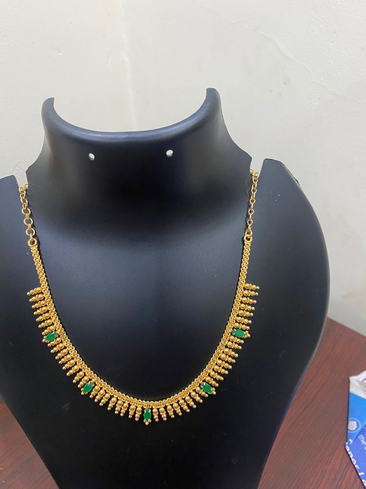 One Gram Gold Plated Jwellary Necklace.Green Stone Work .colour Guarantee .Hand Made Jwellary.Very Reasonable Price.18 Inches