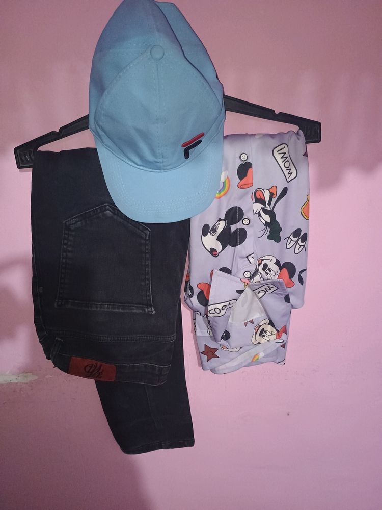 Cap With Printed Shirt And Faded Jeans