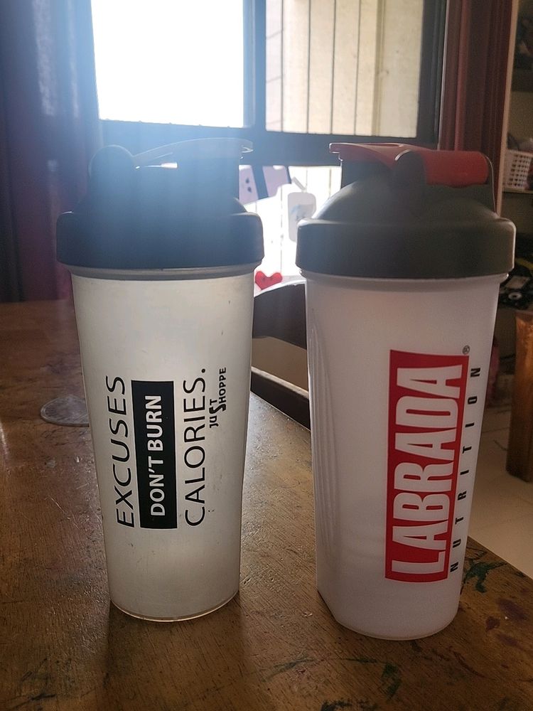 Two Plastic Shakers In Good Condition