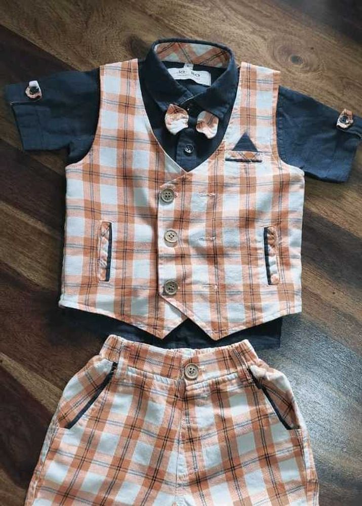 A Set Of Boys Three Piece Suit