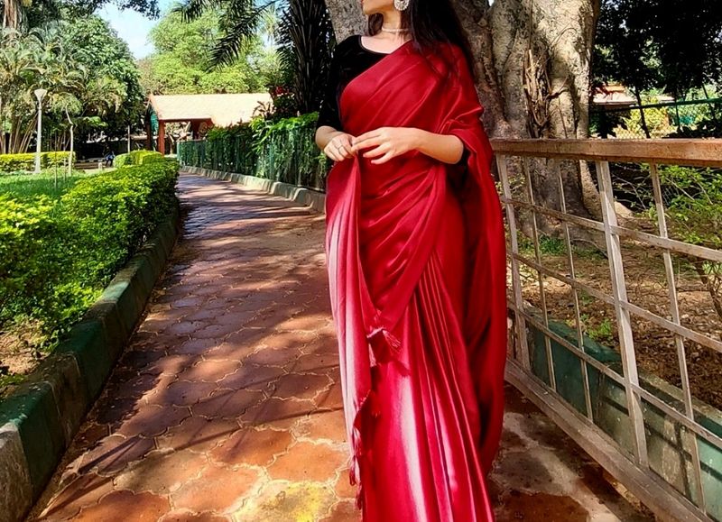 HOT RED SATIN SAREE WITH BLACK VELVET BLOUSE .