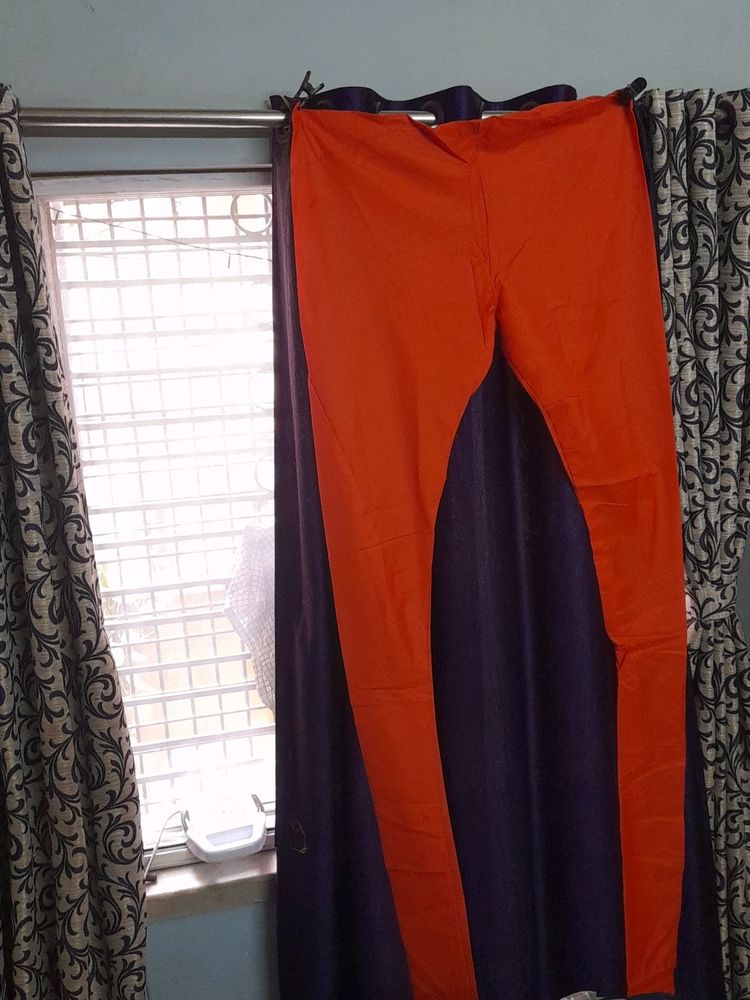 Beautiful orange colour pure cotton churidar pant.