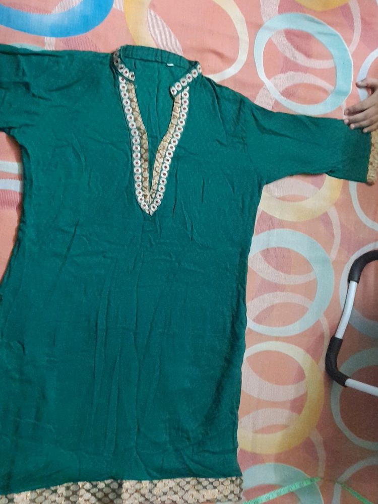 Dark green cotton kurta ...three quarters sleeves...beautiful neck line...no flaws..