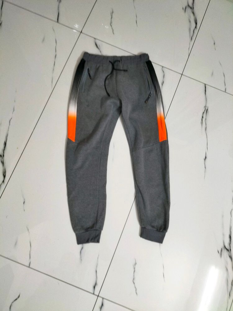 Grey ETEN joggers.