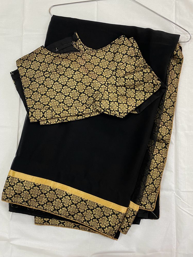 Pretty Black Saree With Golden Border..