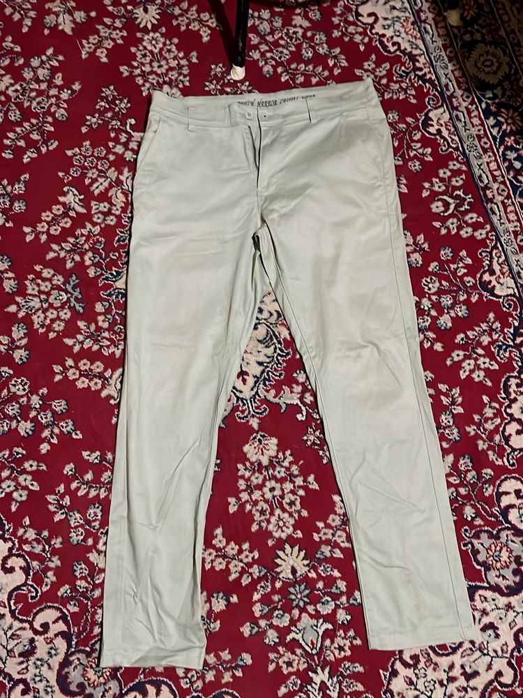 Light Greenish Trouser. In good condition.