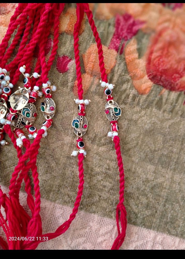 RAKHI with Morpankh, Red Evil Eye & Pearls