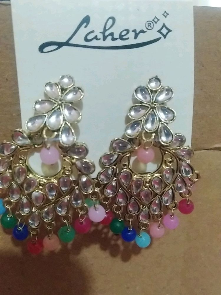 Beautiful ear rings multi colored with stones and gold polish