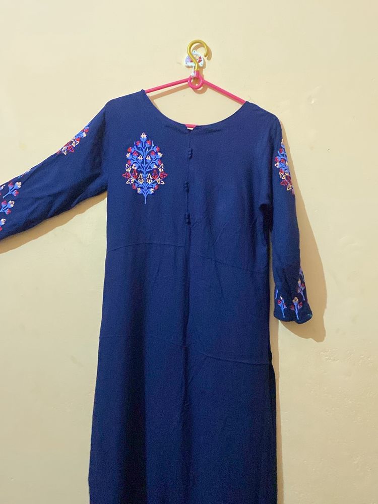 A Dark Blue Long Kurta , With Design On Shoulder.