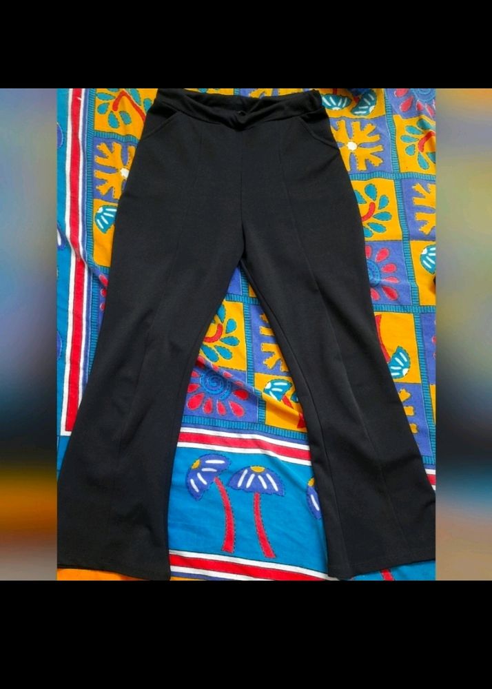 Black flared pants with elastic in waist.