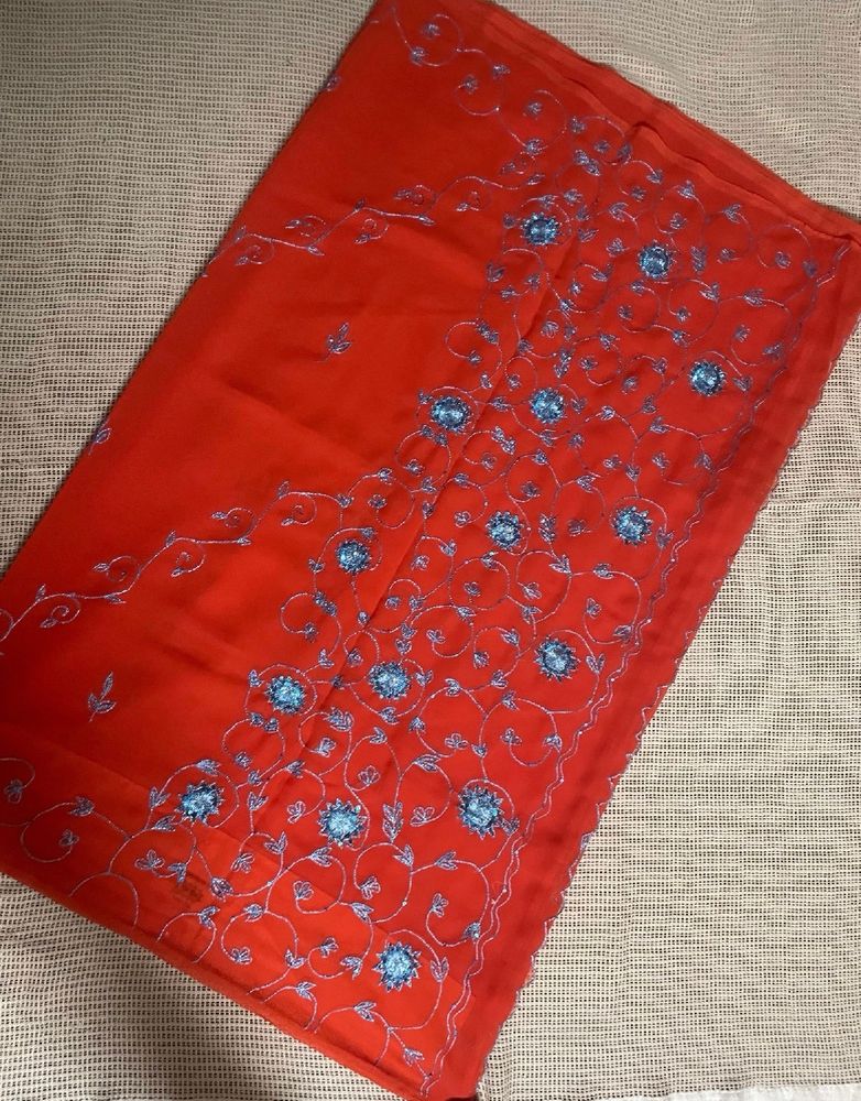 Orange Saree With Blue Shiny Embroidery