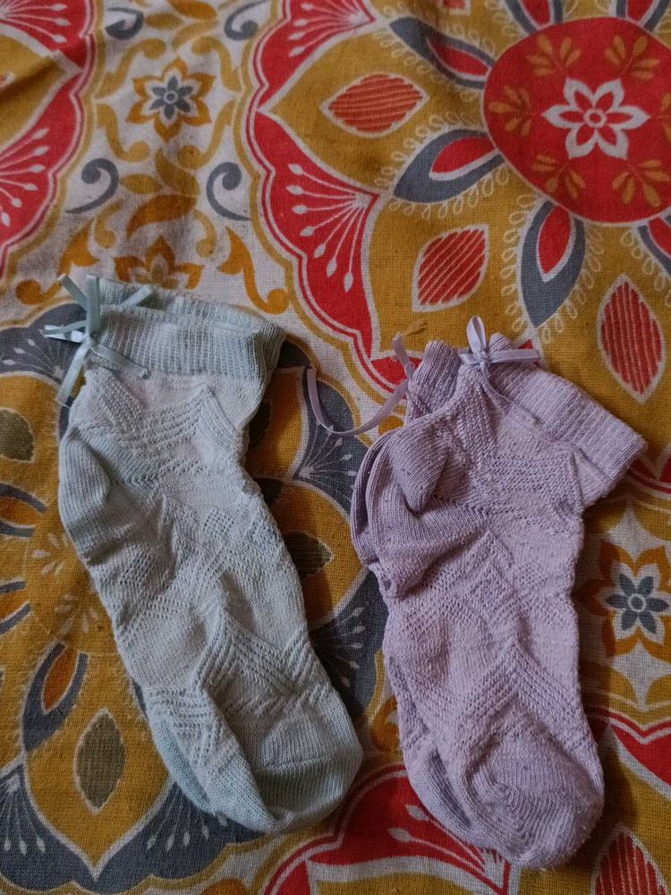 Two Pairs Of Baby Socks. Pink And Green