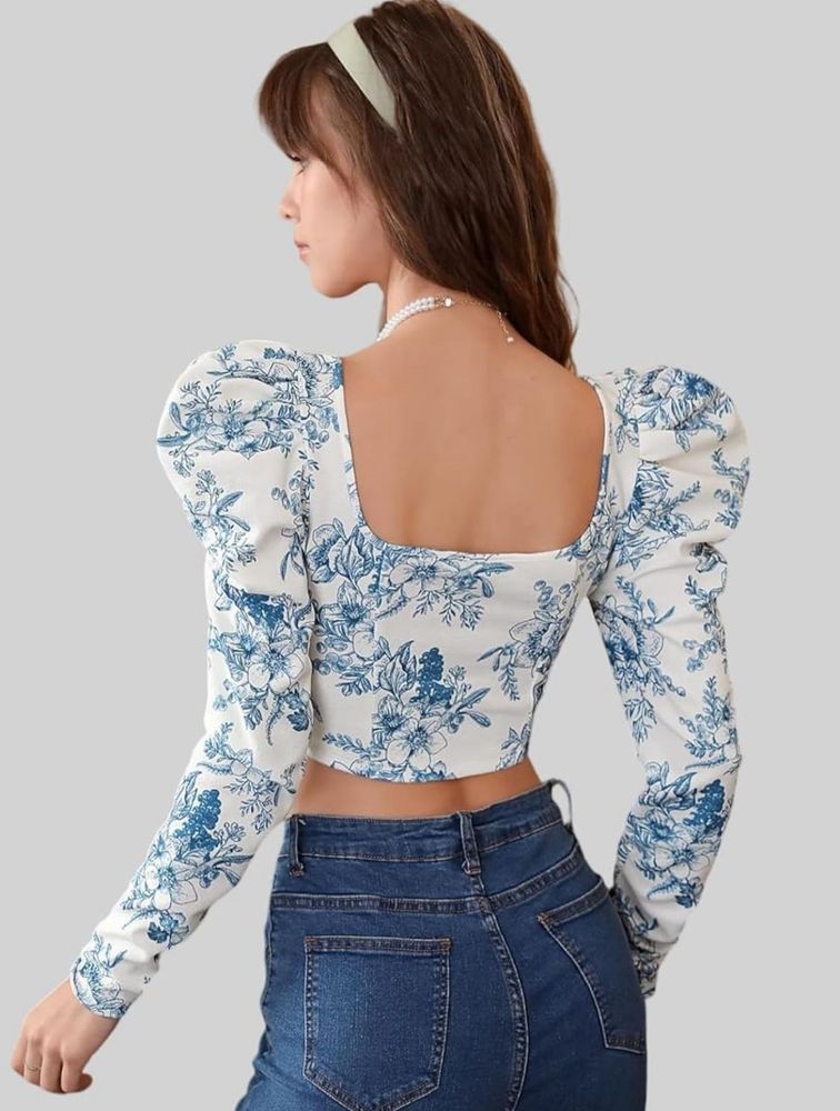 Floral Print: This long sleeve blouse features a v