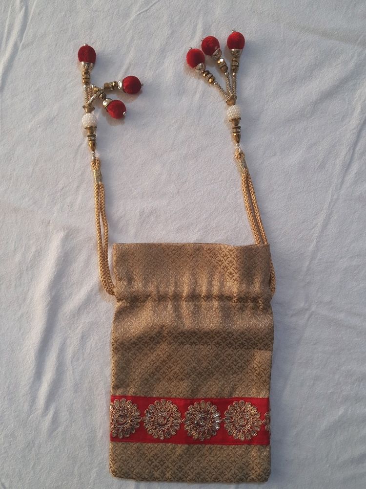 Golden Potli Bag With Red Lace