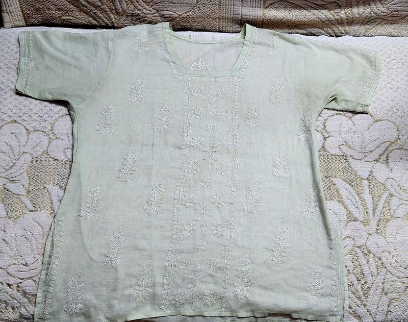 Light Green Colur Short Kurti With White Embroidery on It