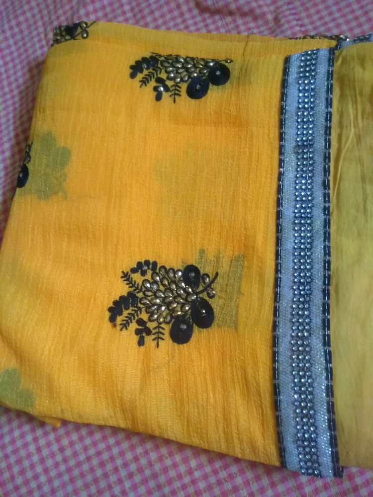 Elegant Yellow Saree With Beautiful Black And Silver Border