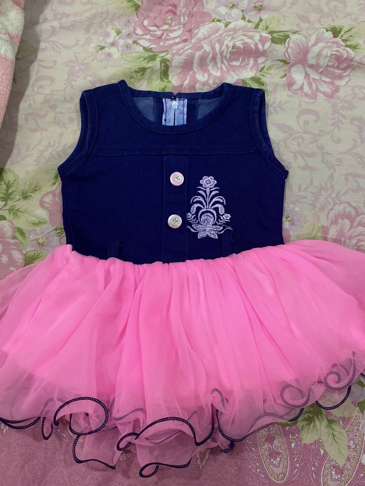 Baby girl party wear frock with pink net in bottom And blue jean upper side,suitable for 1-1.5 yrbaby girl,has button In front and has soft net,baby will be comfortable in this cloth,has zip in back