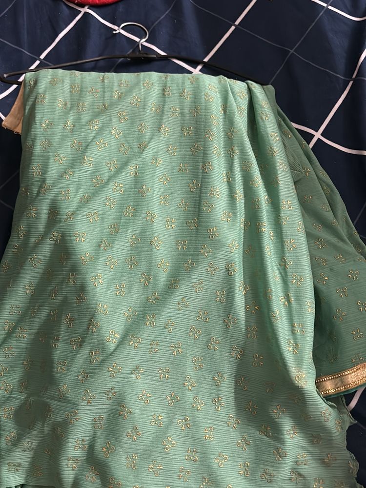 Sea Green Color Saree With Golden Blouse