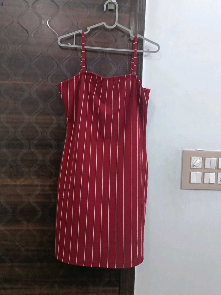 A Red Color Dress With White Stripes