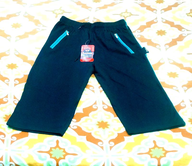 IT IS A NEW UNISEX BLACK COLOR CAPRI.....