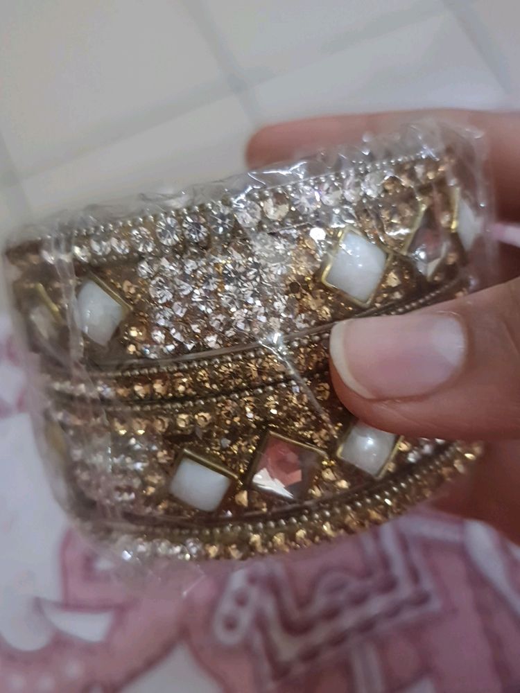 Stone Bangles Of White And Golden Color.