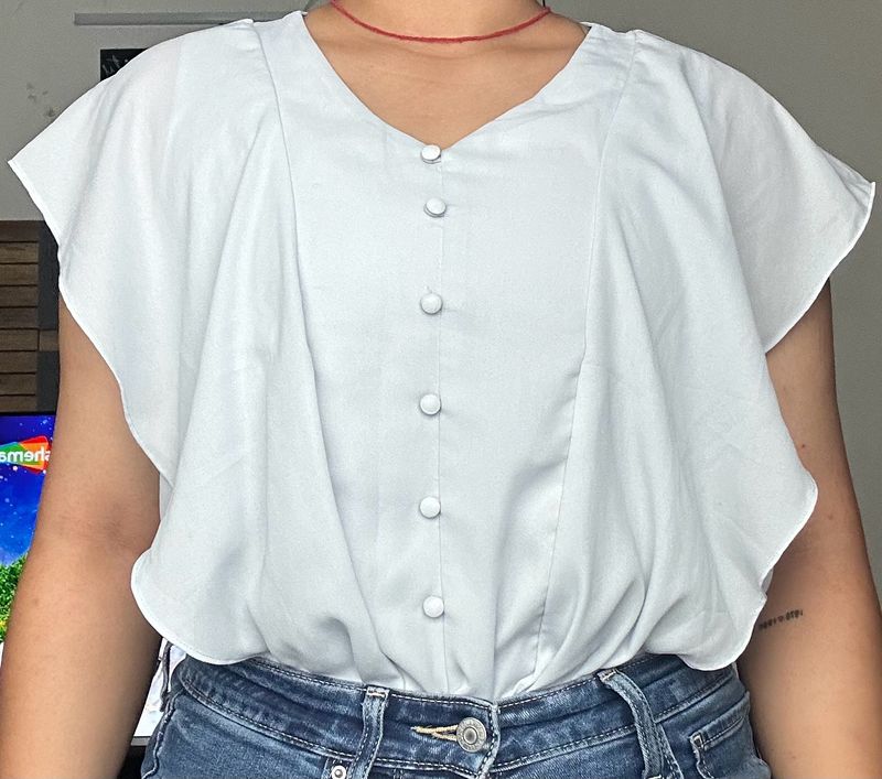 light blue frilled top