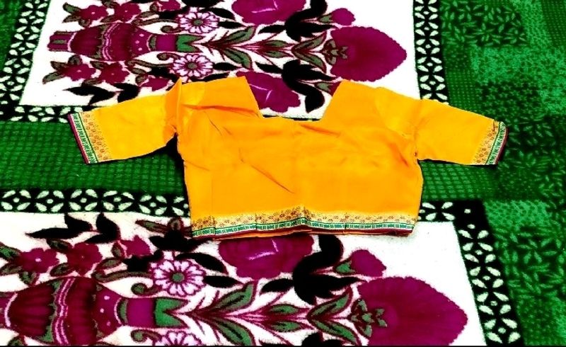 IT IS A MUSTARD COLOR WOMEN'S BLOUSE....