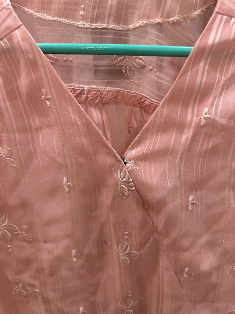 A Pretty Peach Top With Delicate Embroidered Motif