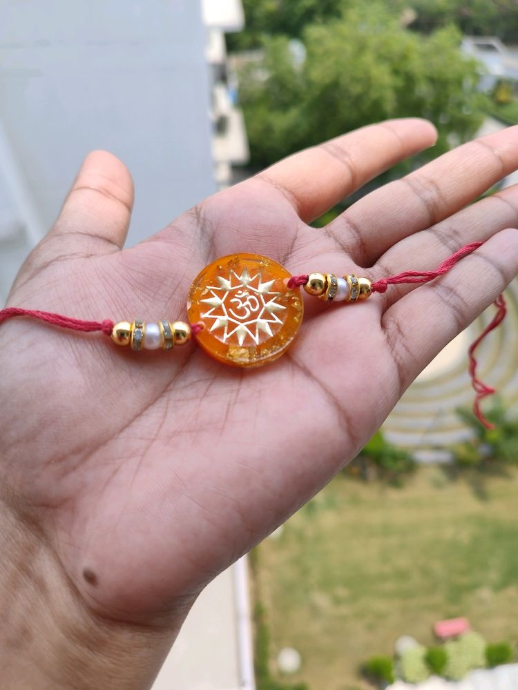 Orange Om Resin Rakhi