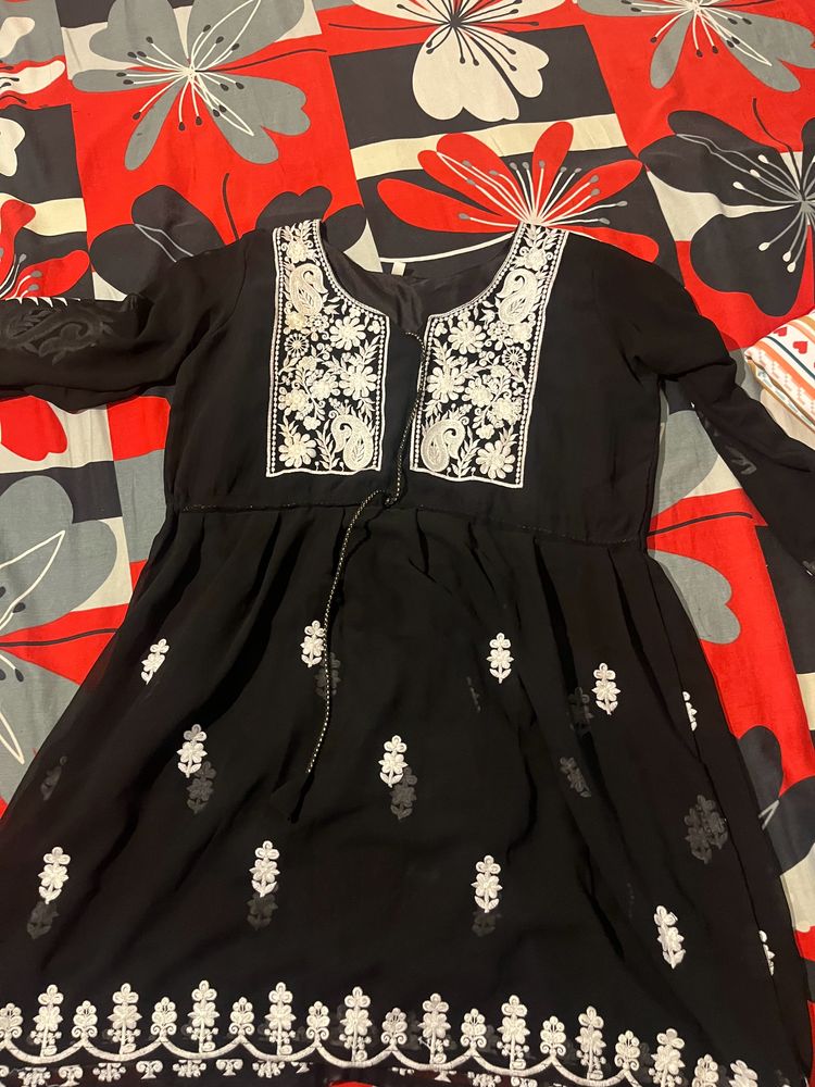 A Short Black Kurti With Work Of White Chikankari