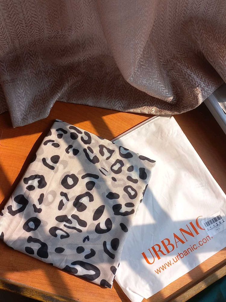 BRAND NEW URBANIC top with White Leopard Print.