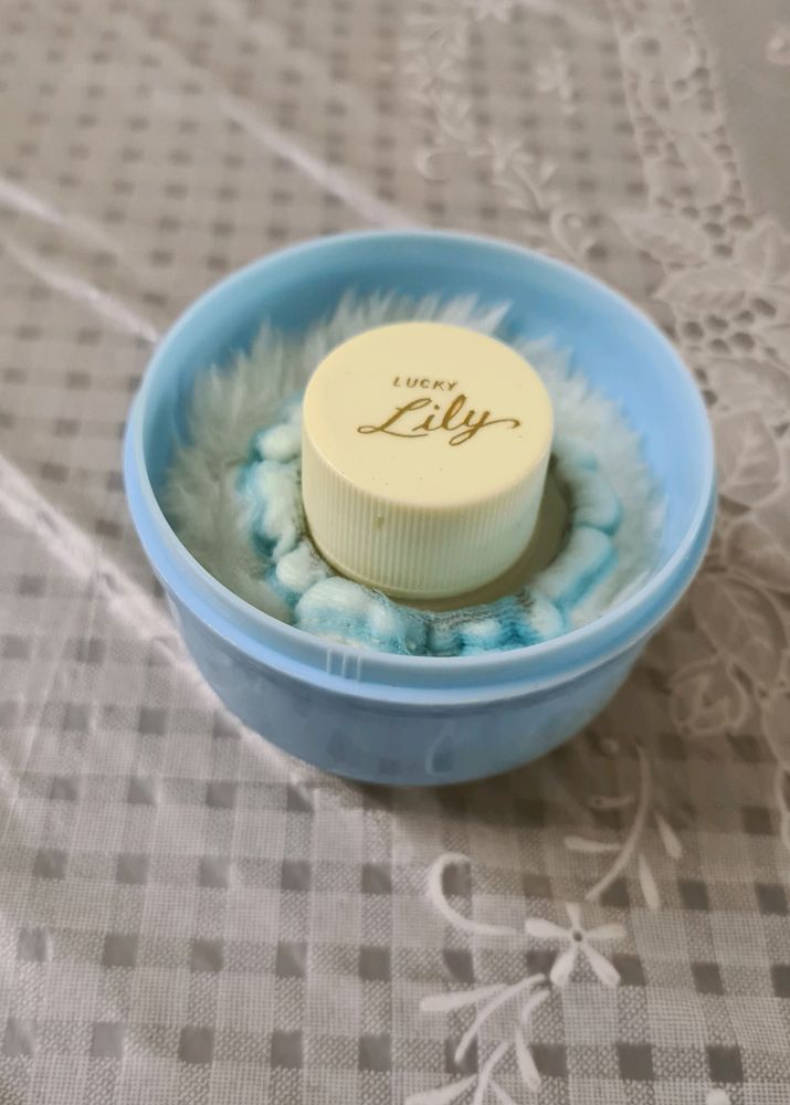 Baby powder puff with a refill container