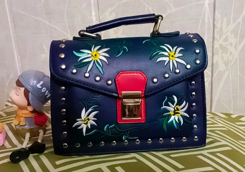 Women Solid Handbag With Beautiful Embroidery Work