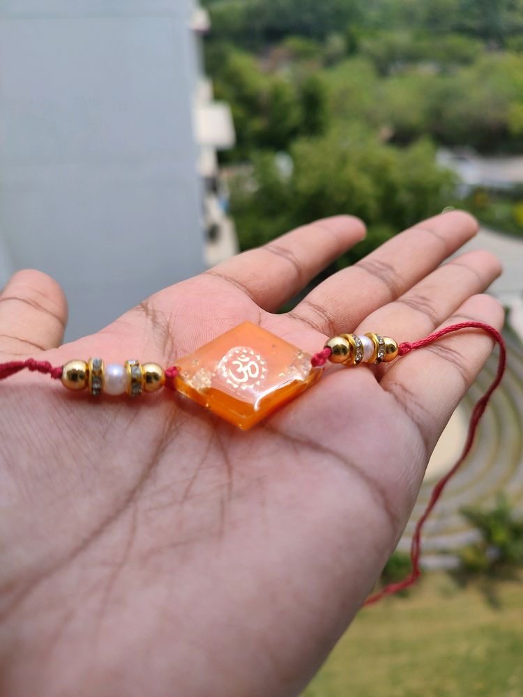 Orange Om Resin Rakhi