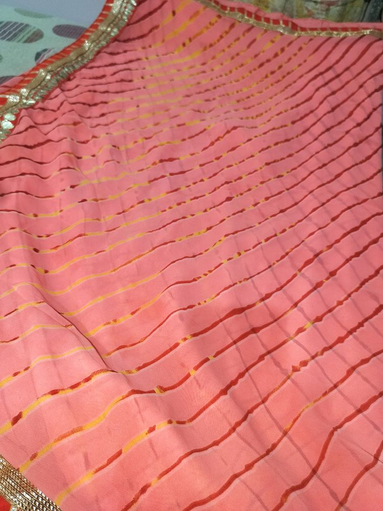 A Peach Colour Saree With Beutiful Red Strips