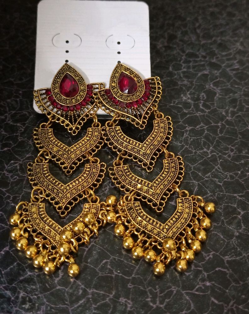 Beautiful red golden colour long jhumka earrings