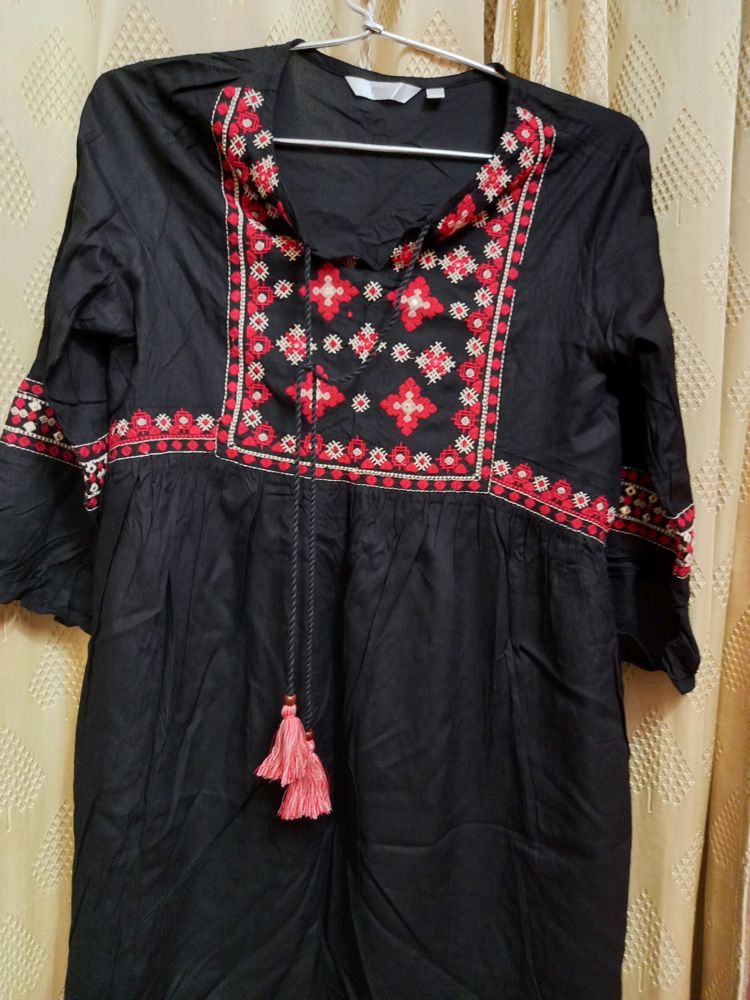 Embroidered Black Peplum Top