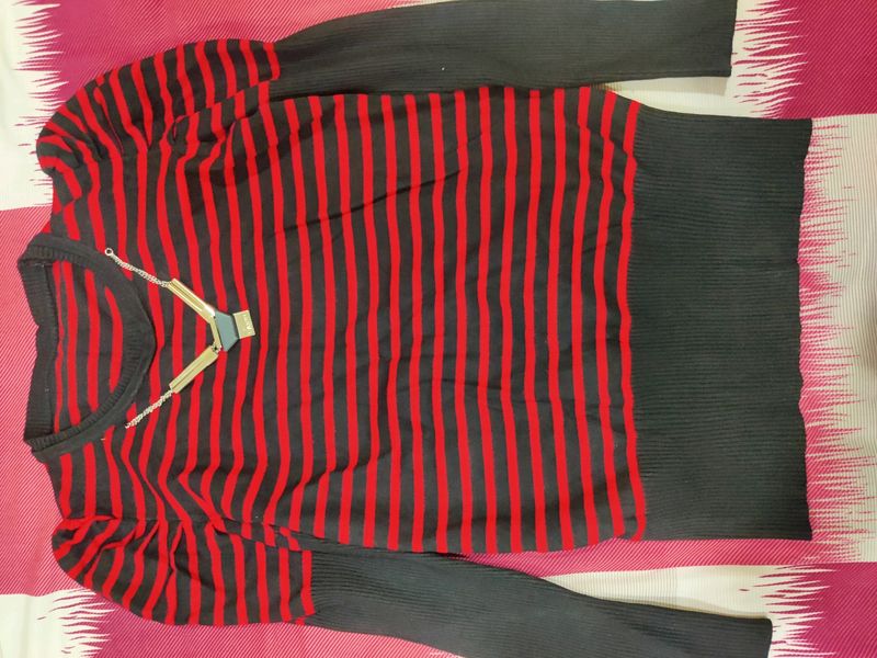 A Red And Black Stretchable Top Of Size L Which ca