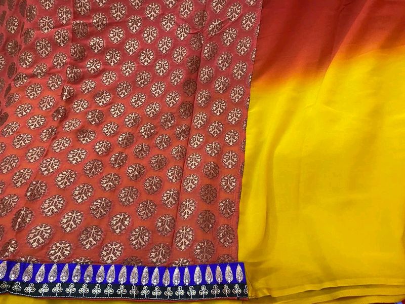 YELLOW ORANGE SHIFFON AND HEAVY EMBROIDERY SAREE