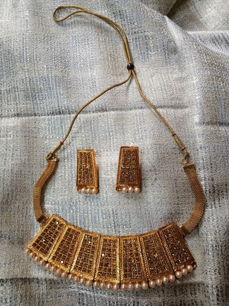 Golden Necklace And Earrings