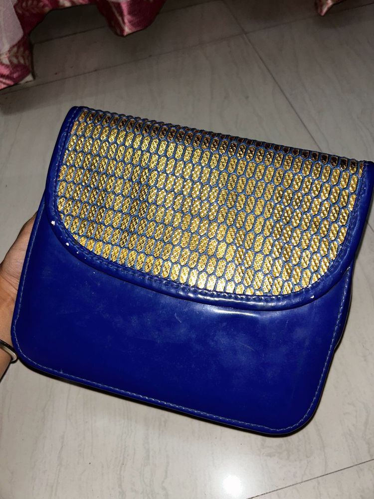 Gold Toned Blue Bag