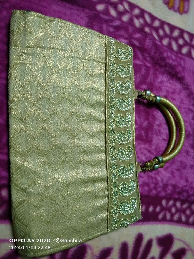 Golden Clutch With Zari Work