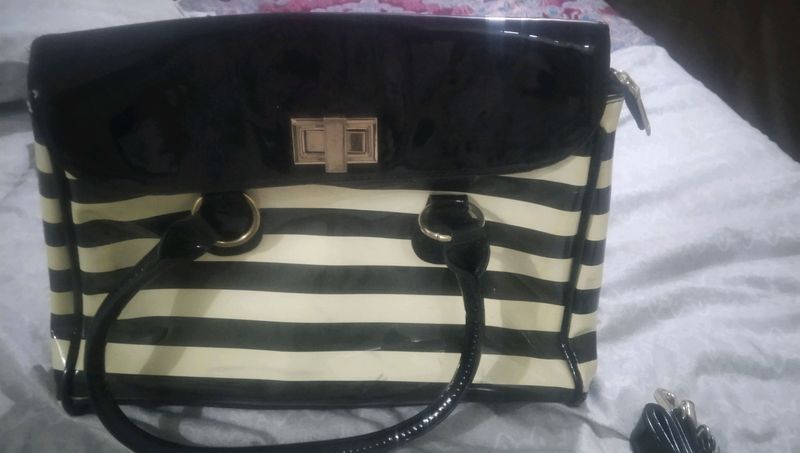 white and black strip handbag