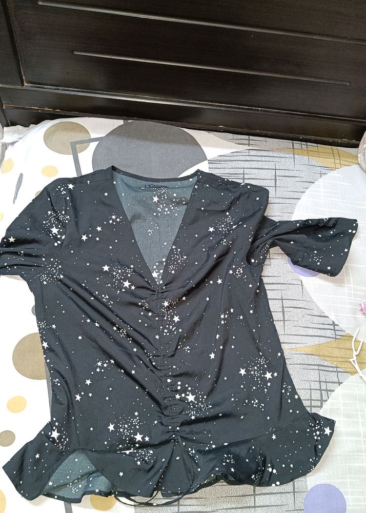 Get Free Delivery On This Starry Black Top. No Damage.