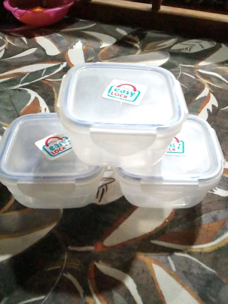 Three Plastic Boxes