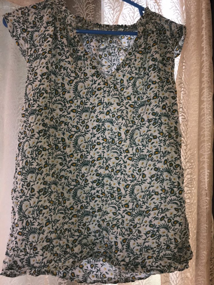 green printed Top with Leavy-flower Print on it.