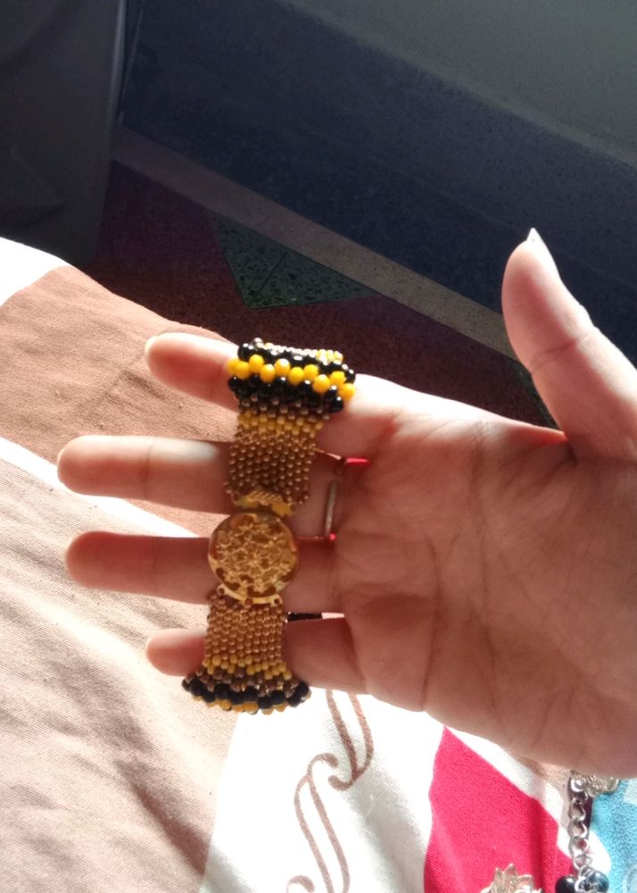 Unused Yellow Bracelet With Black Pearl