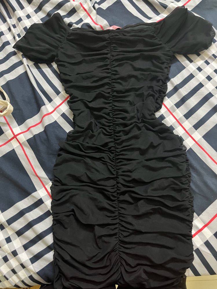 black ruffled mini dress