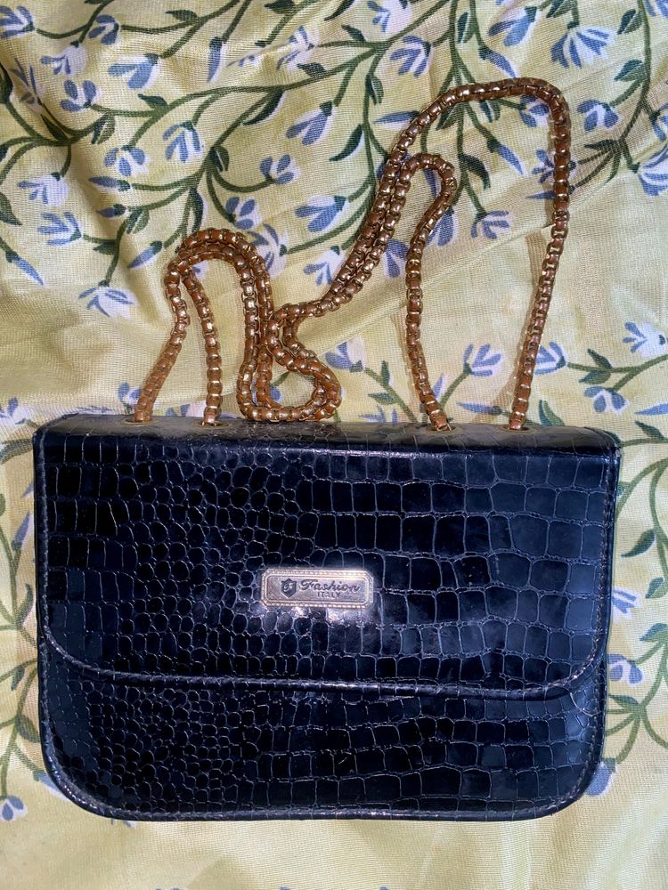 A Black Slingbag For Women