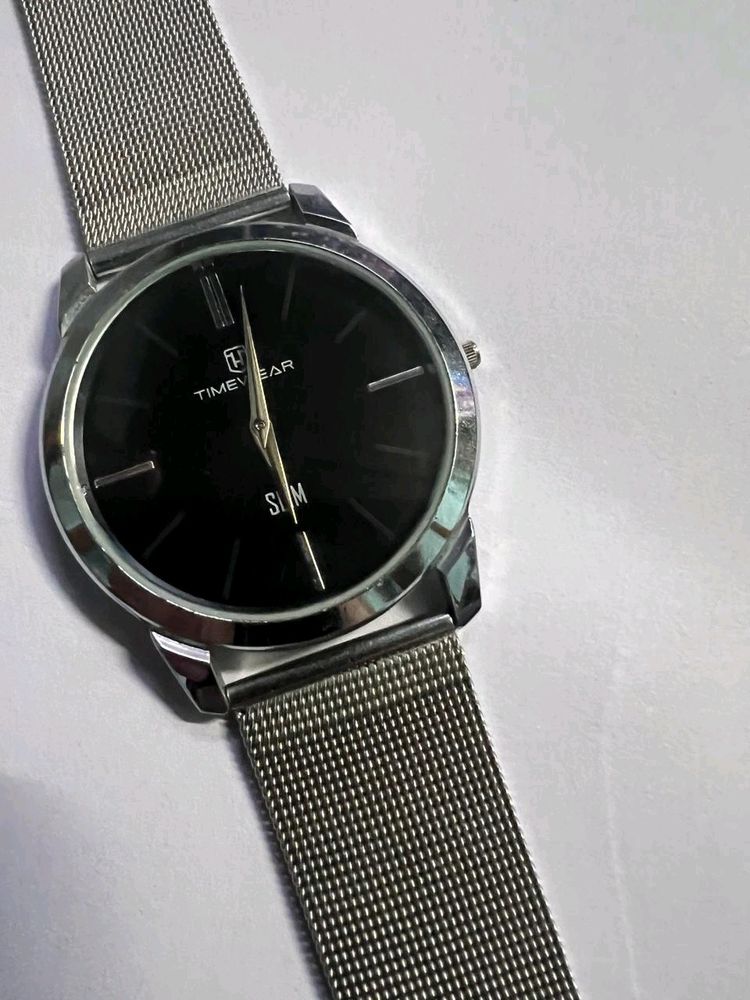 slim metallic watch